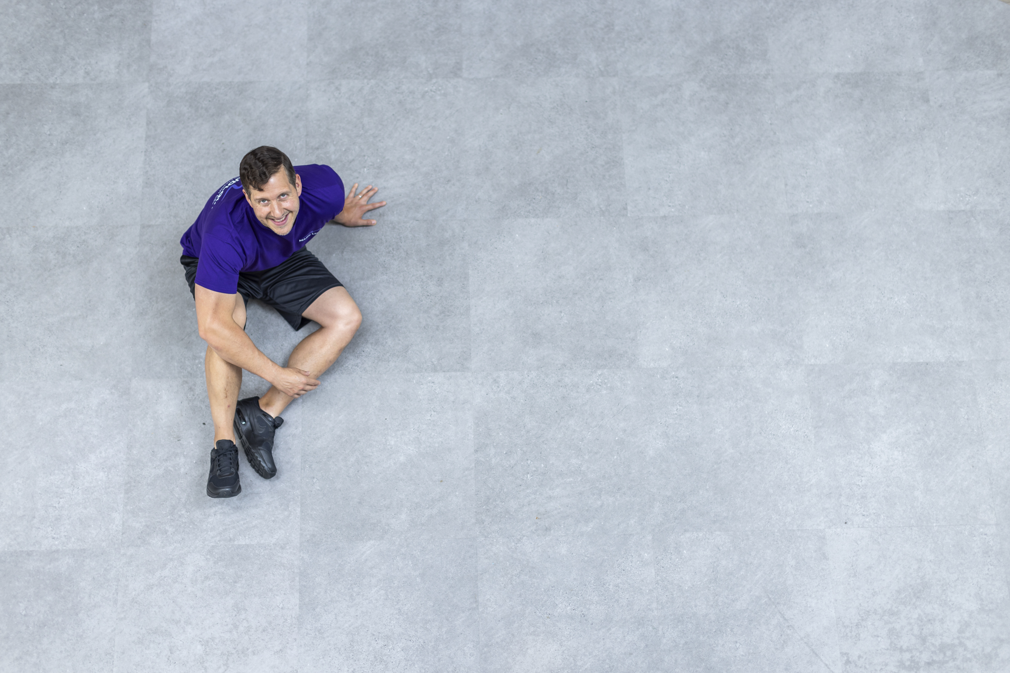 Personal trainer coaching a client with strength training near Watford