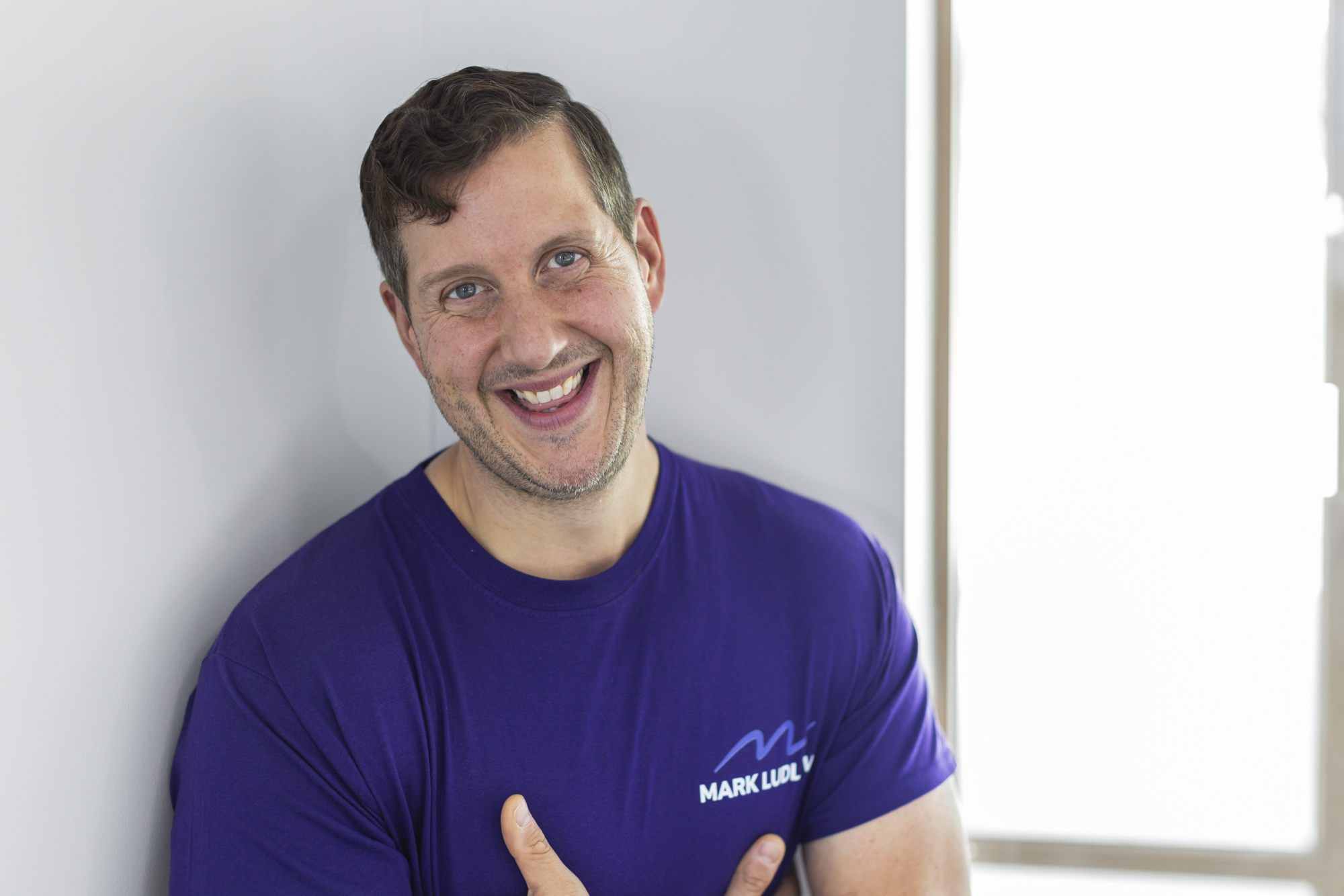 Online personal trainer coaching a client via Zoom with workout guidance